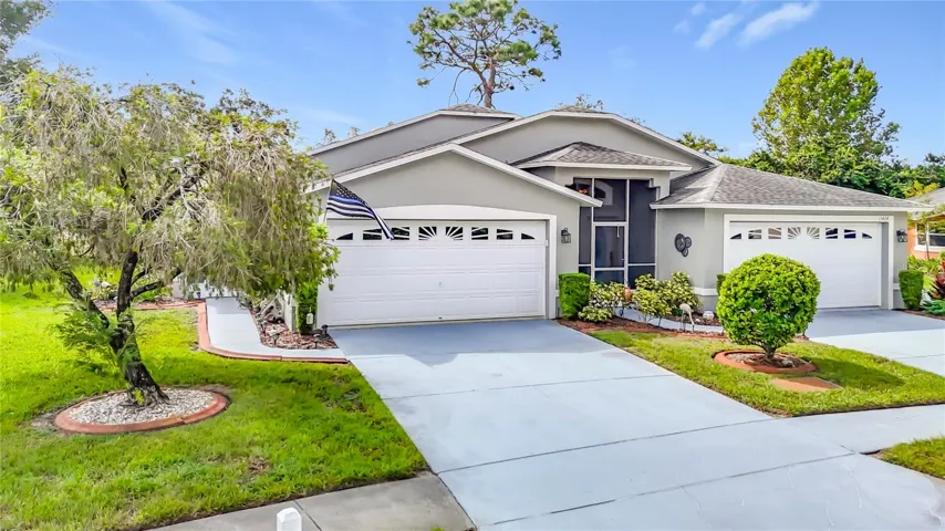 Welcome to 13428 Norman Circle, located in Meadow Oaks - Fairway Villas. This is a 1,292 sq. ft. 2 bedroom, 2 bath, 2 car garage Villa which back onto the 10th fairway Meadow Oaks 18 hole public golf Corse