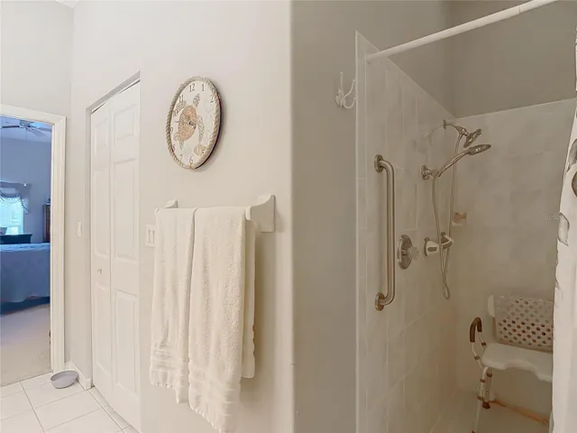 Walk in shower has a safety bar in place
