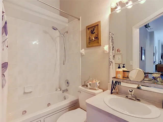 The seconday bathroom is convenient to Bedroom 2 and kitchen. Has combination tub and shower set up.