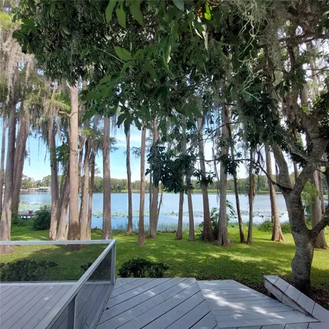 note the rear-facing ramp from the raised wood walk leads into back yard