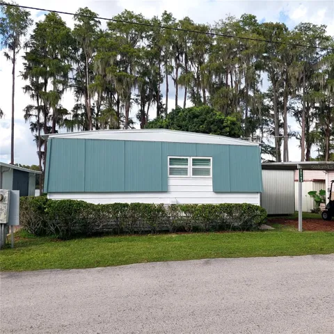 street-facing side is very private, the view is in the rear....nice Homes of Merit built manufactured home called the Dutch Manor.  All exterior siding was replaced with Hardie board.