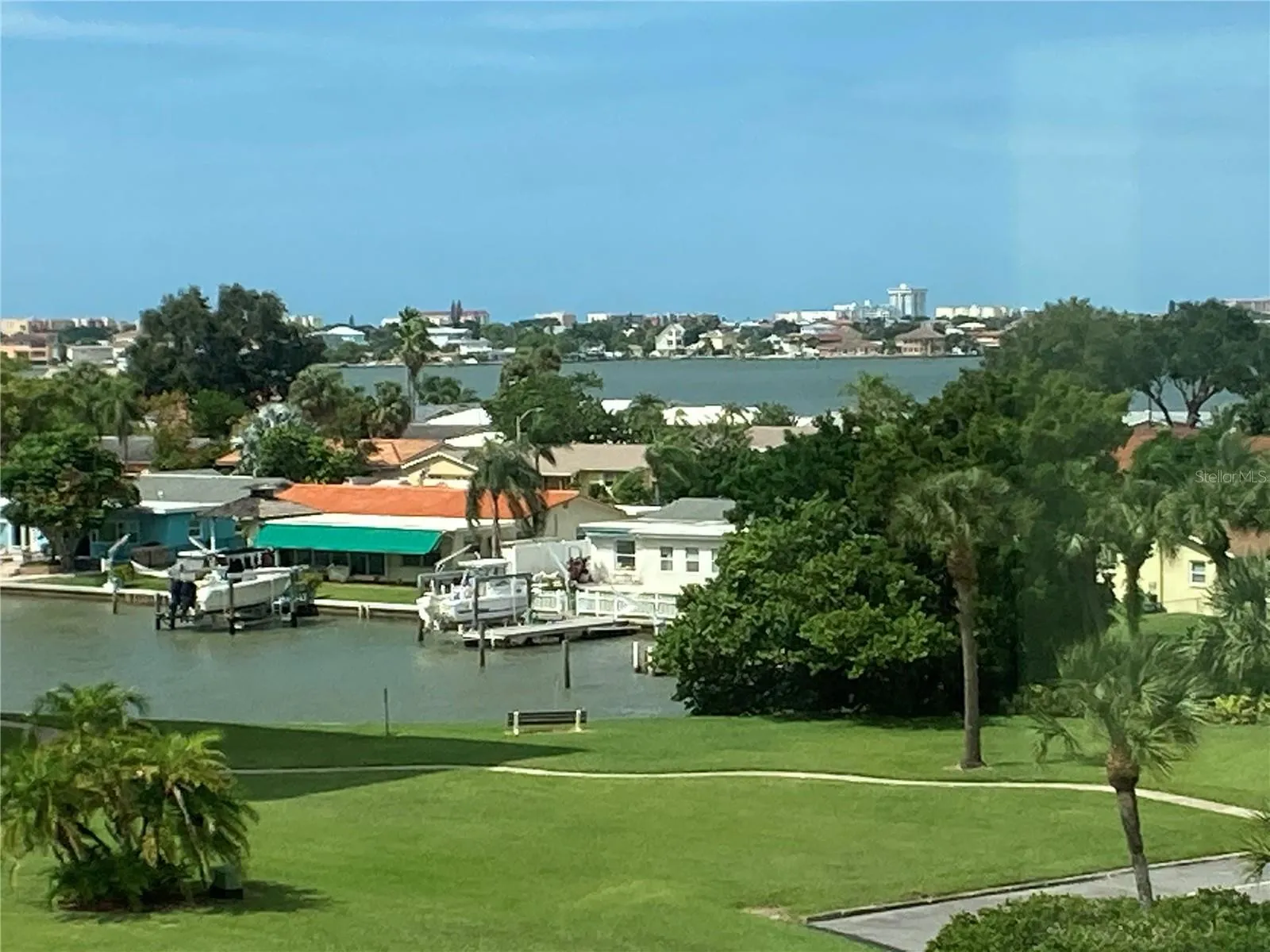 The northern border of Sea Towers. There’s also are “fingers” of water on the North and South borders. Sidewalk path for strolling the property