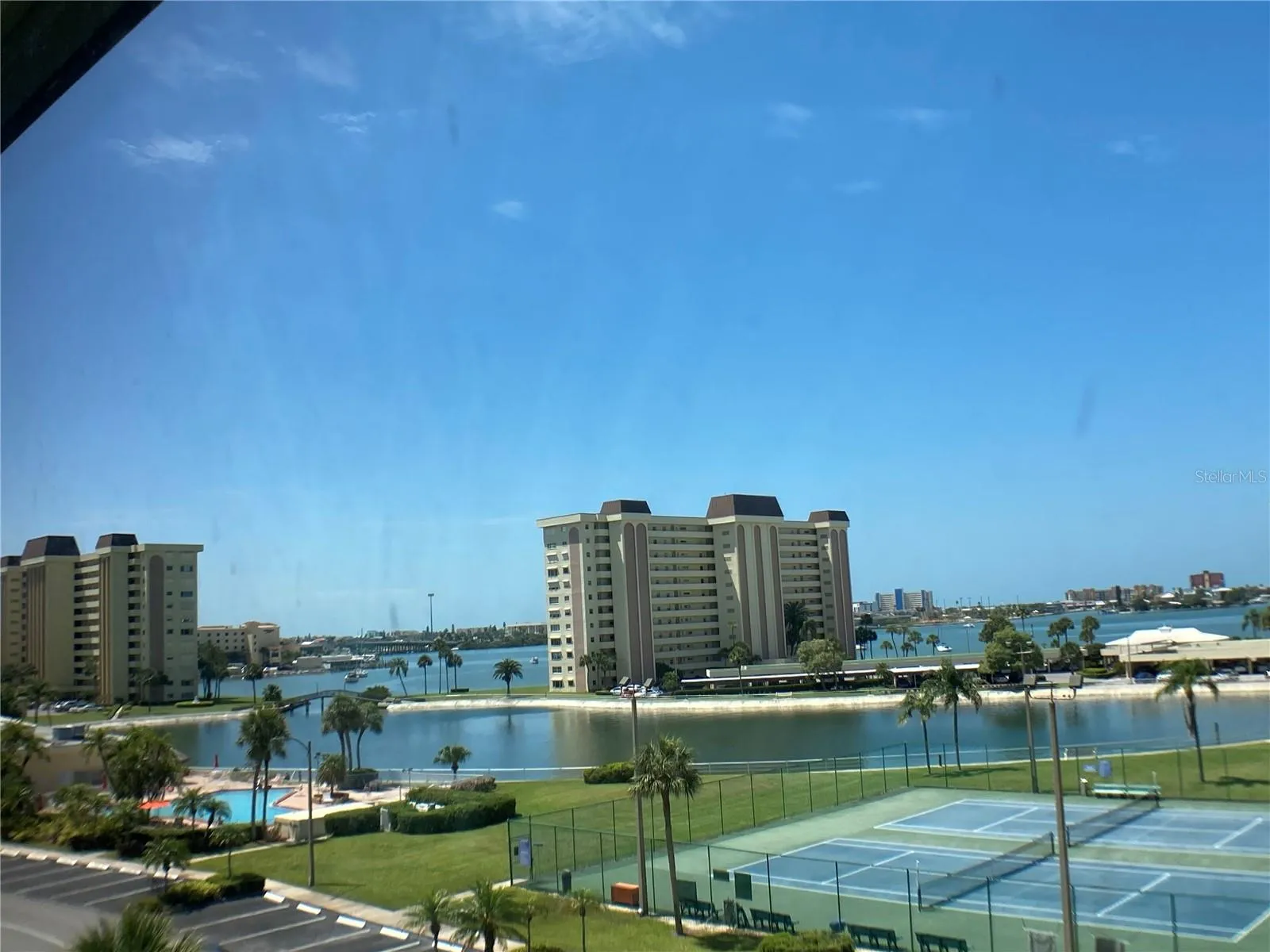 View from Condo - Boca Ciega Bay, Independence Lagoon, main pool for daily aqua fit  classes, tennis courts that are also used for pickle ball