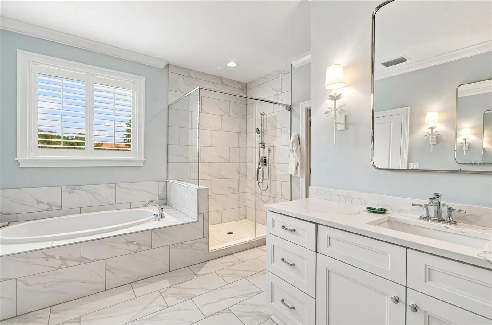 Spacious bath offers separate tub and shower.