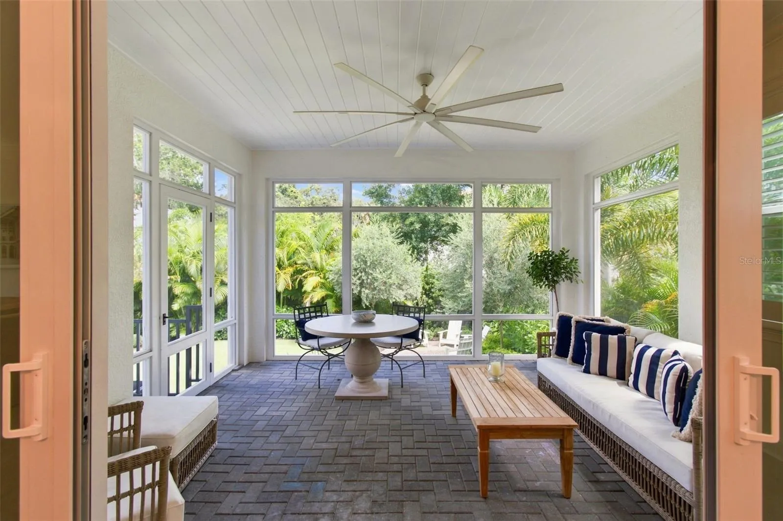 Tongue and grove ceiling and wood details add character to the screened porch.