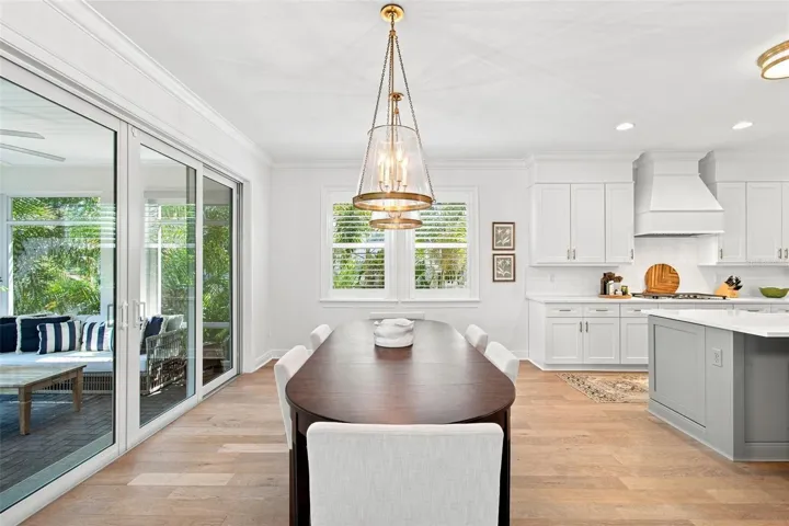 Dining area opens onto screen porch.
