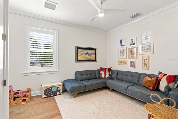 Downstairs bedroom that currently acts as a playroom.