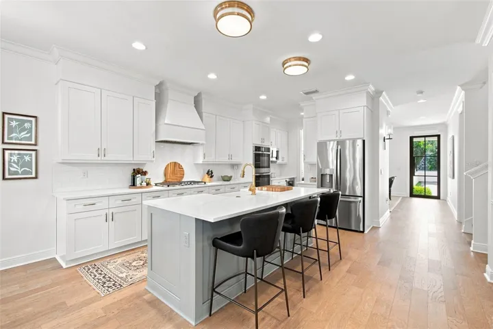 Classic design with shaker cabinets & quartz counters, in white and soothing tones.