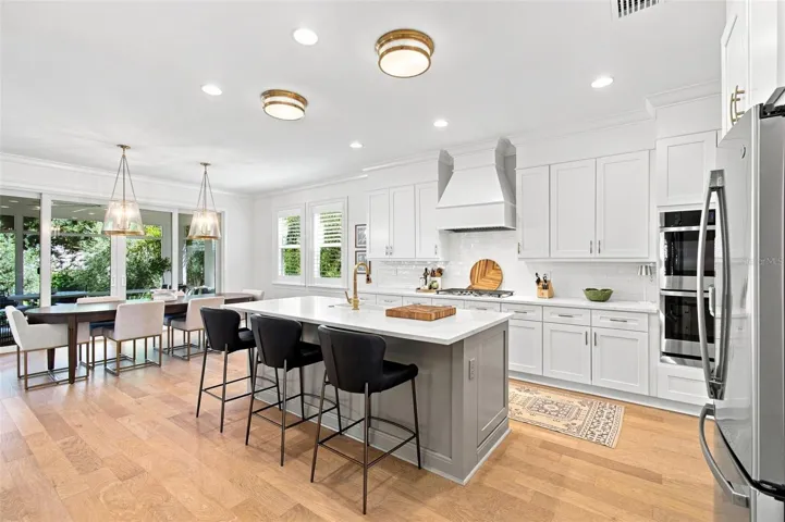 The chef is in the middle of the activity with the open kitchen, dining and family room.