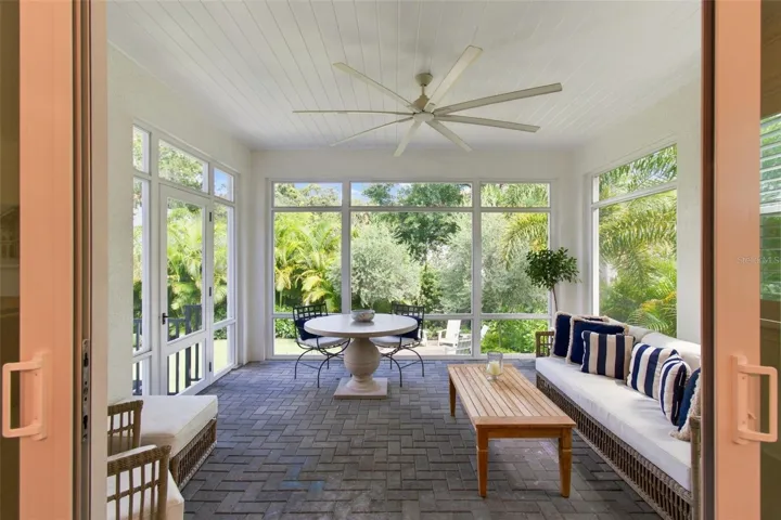 Tongue and grove ceiling and wood details add character to the screened porch.