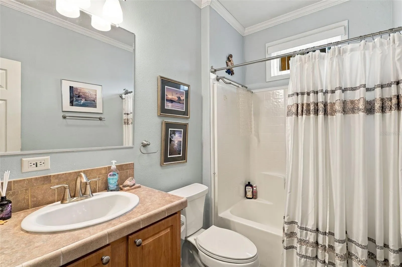 Guest bath with updated fixtures and tub/shower combo.
