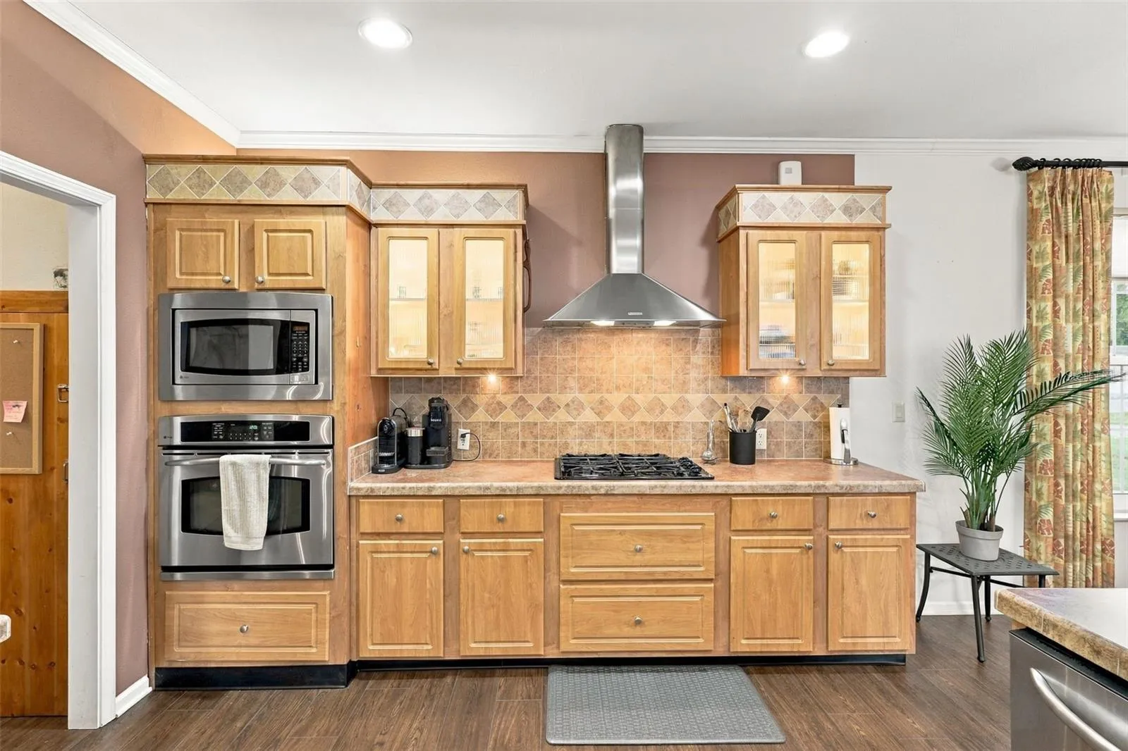 Tons of cabinetry with undercabinet lighting and built-in oven and microwave.