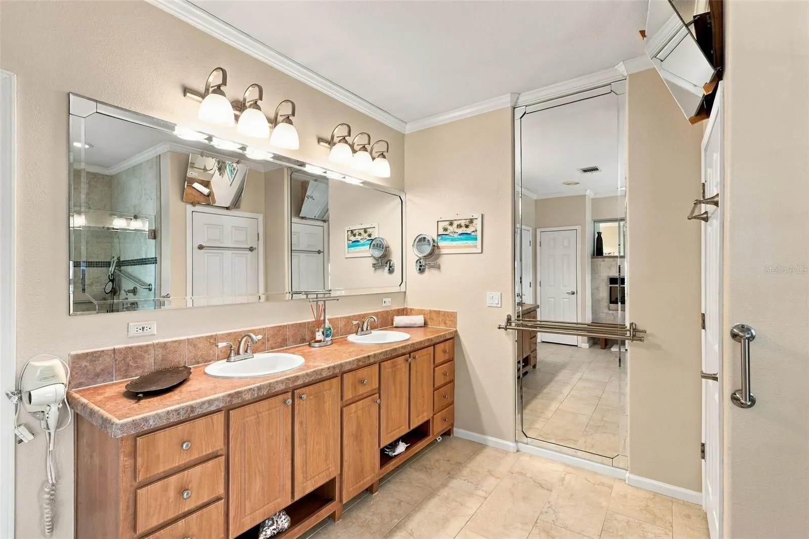 Dual sinks and updated fixtures in the ensuite bath.