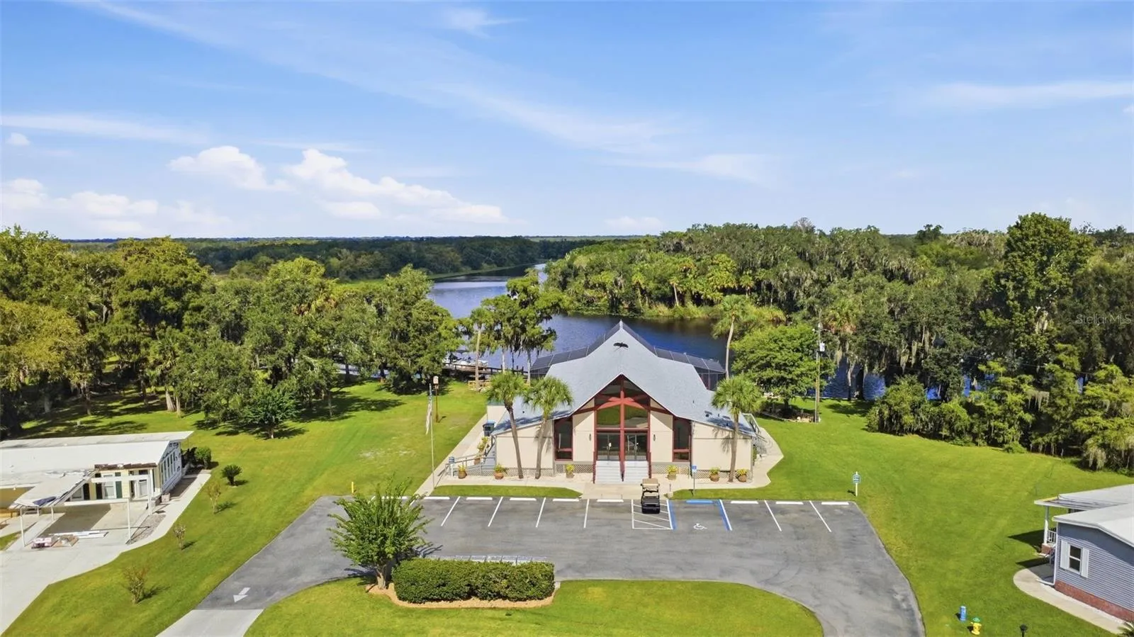 Community center w/swimming pool on the St. Johns River. Your boat slip is on the other side of this building.