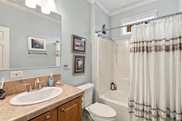 Guest bath with updated fixtures and tub/shower combo.