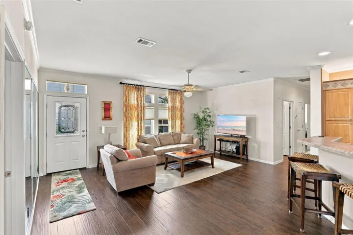 Main living area. Notice all those windows and the beautiful flooring!