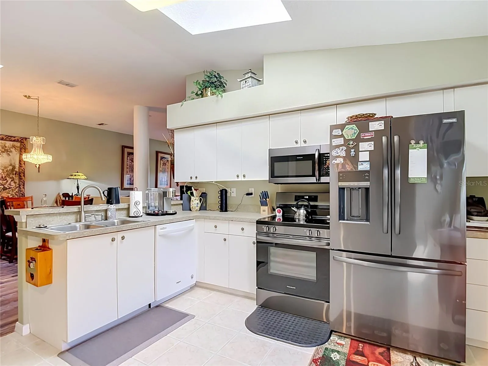 The kitchen is well lit with a skylight giving you natural lighting. Newer appliances. NOTE: the refrigerator does not convey with the property.