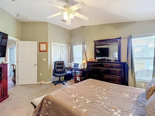 2 good sized windows and doors out to the patio again give you a lot of natural light. Room presently sitting on carpet.
