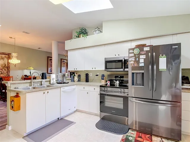 The kitchen is well lit with a skylight giving you natural lighting. Newer appliances. NOTE: the refrigerator does not convey with the property.