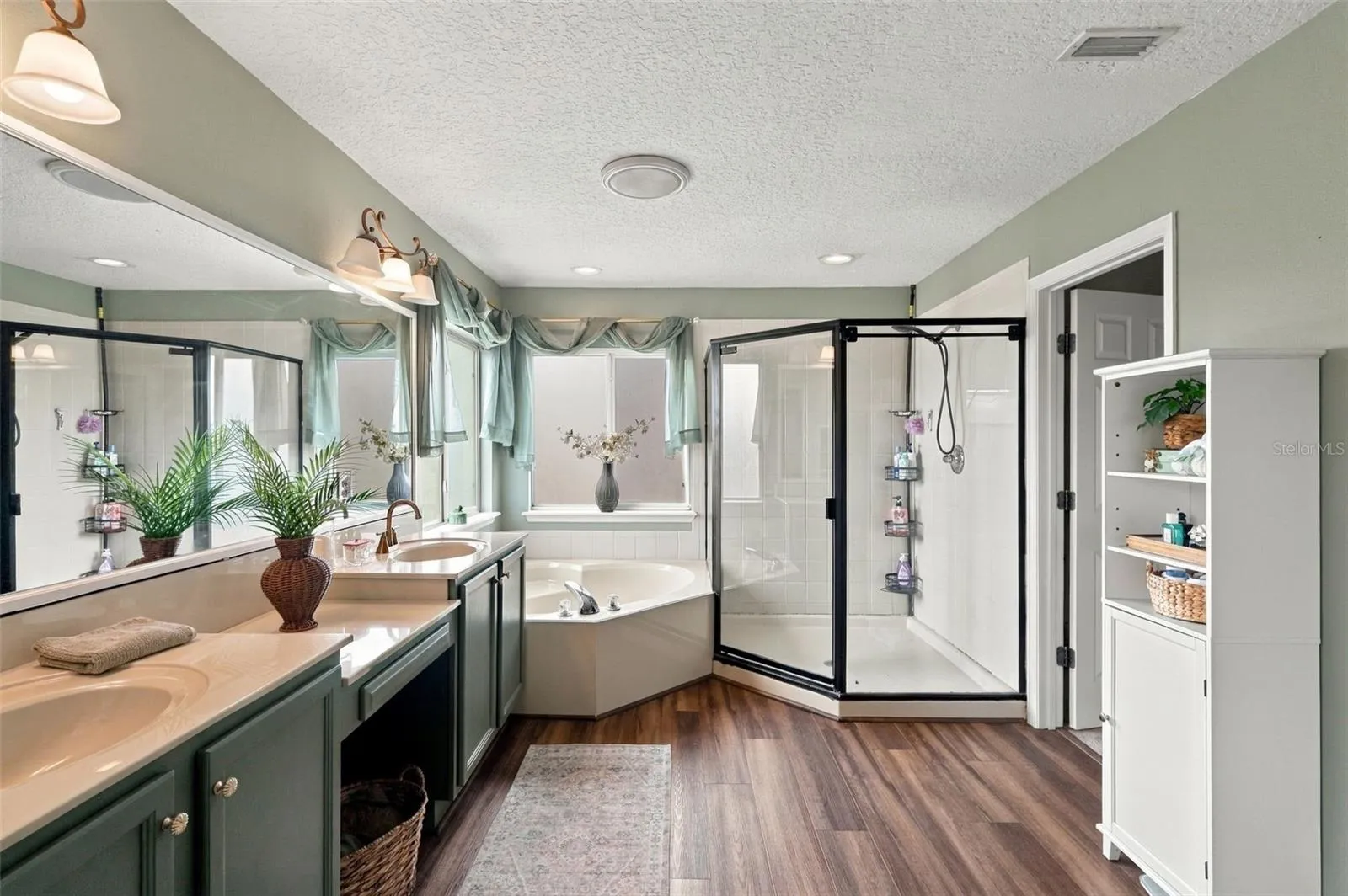 Enjoy the dual vanity, spa tub, walk-in shower and walk-in closet all in one space.