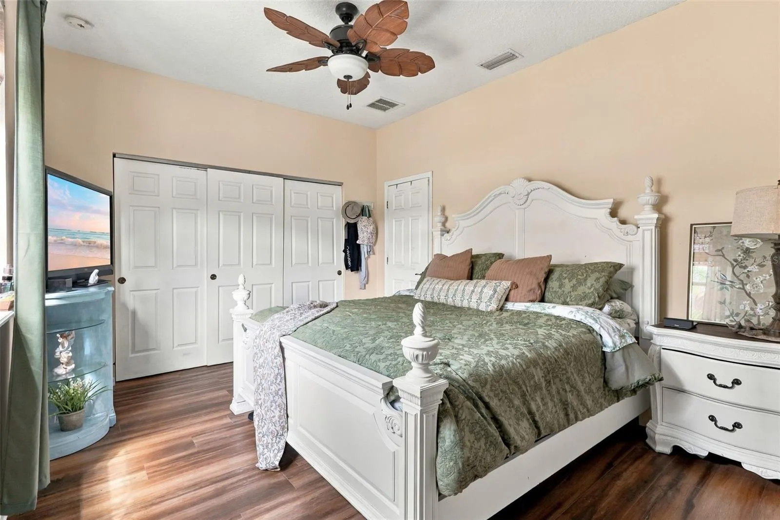 This large bedroom on the main floor features a fully remodeled bath just outside.