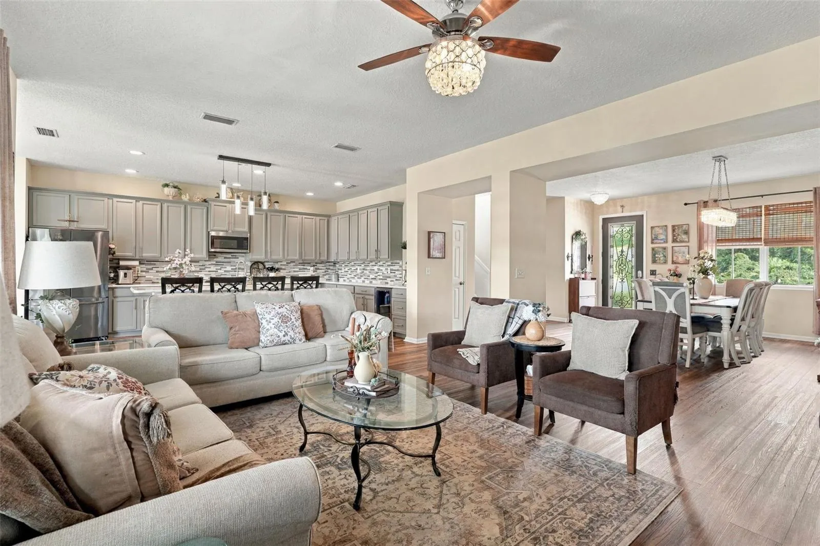 The main living area flows seamlessly with the kitchen and dining areas