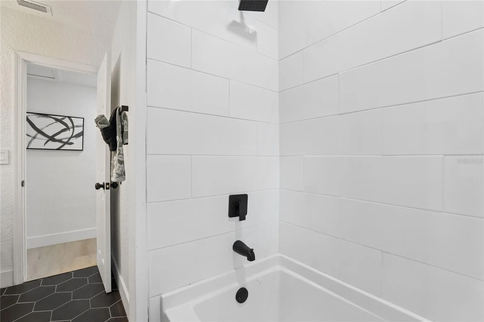 Stylish second bath with vessel sink and contemporary finishes