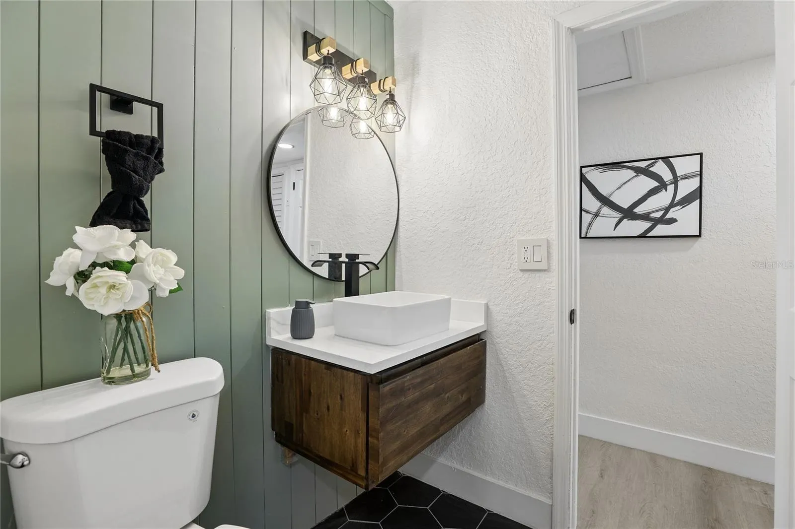 Beautifully redesigned second full bathroom with warm wood accents