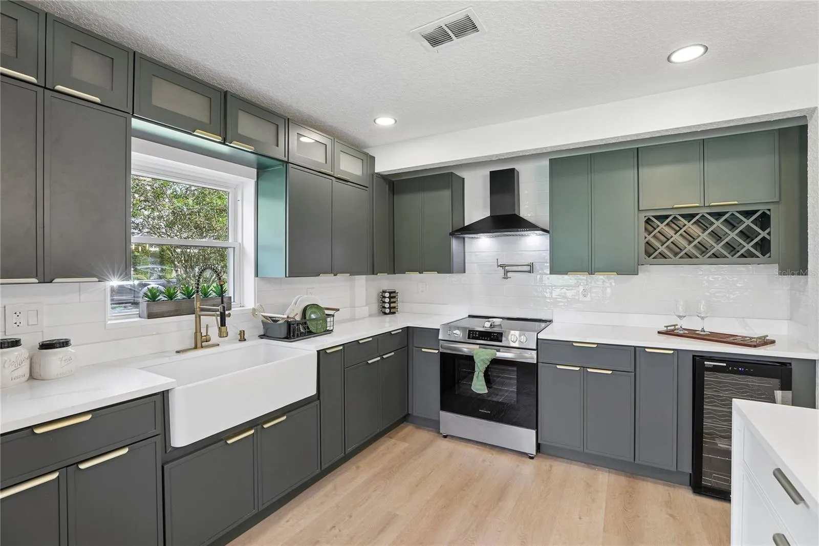 New cabinetry, quartz countertops, stylish hardware and statement finishes