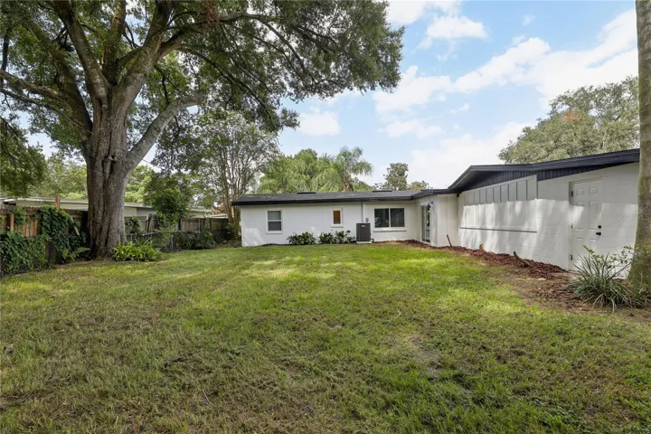 HUGE backyard with mature trees and plenty of room to enjoy the Florida lifestyle