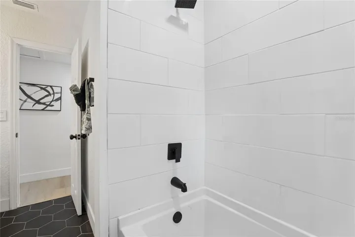 Stylish second bath with vessel sink and contemporary finishes