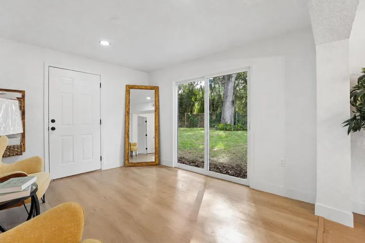Large sliding glass doors create an easy connection to the outdoor space
