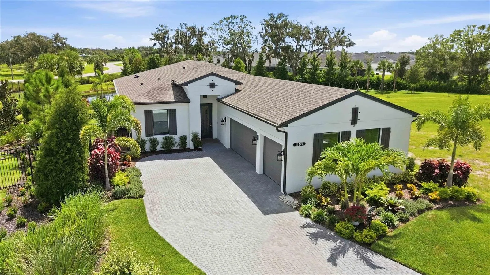 Upgraded, 3-Car Laura in Gated Woodland Preserve