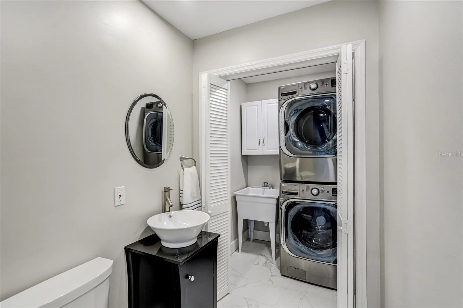 Laundry room with half bath