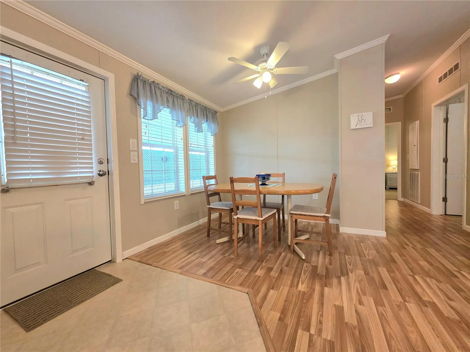 Main entry door, Formal dining area and hallway to bedrooms.