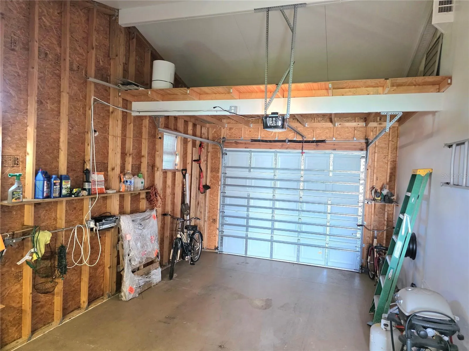 Attached climate controlled 1 car garage with electric opener, loft storage &amp; work bench.
