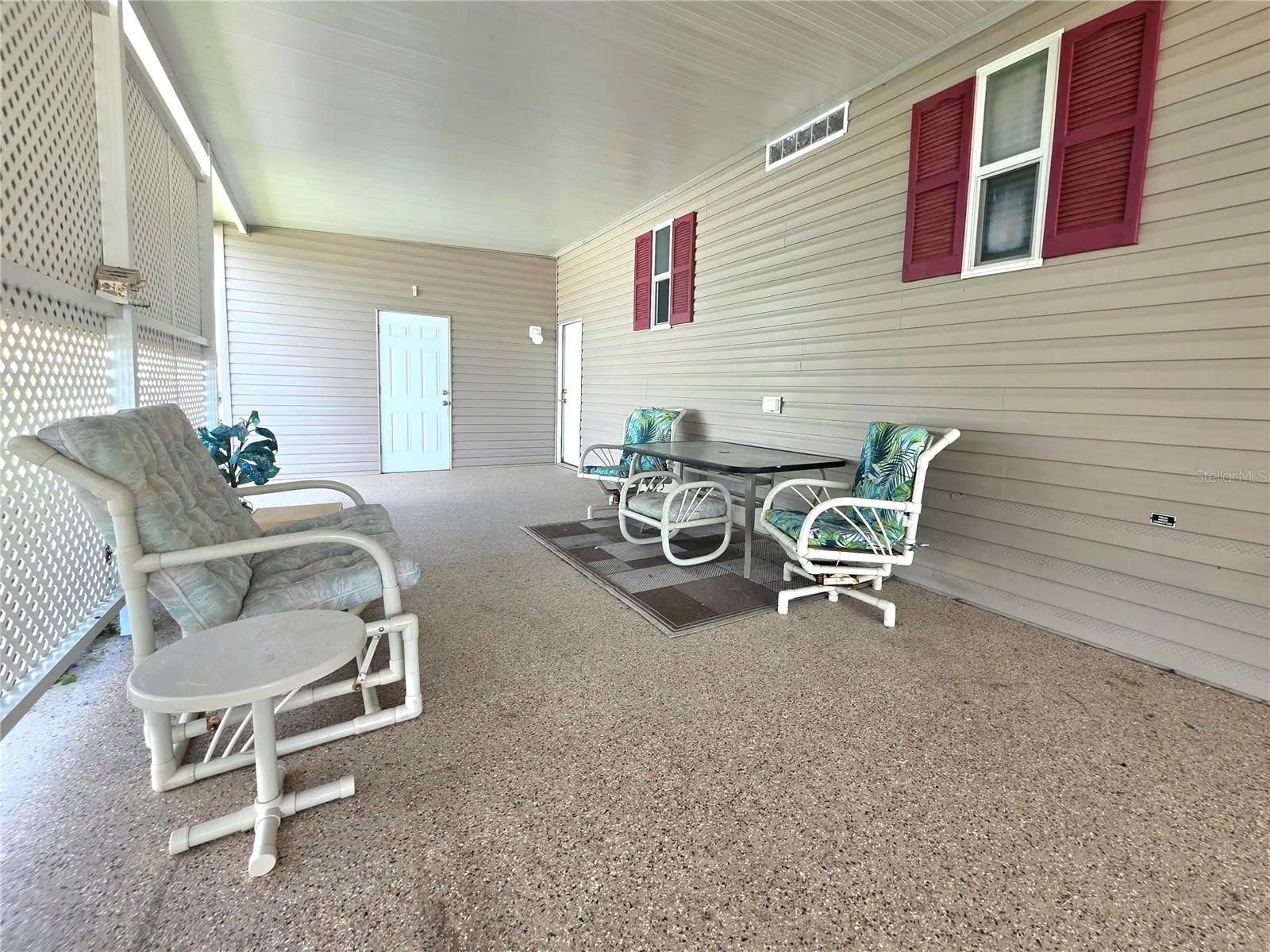 Carport seating area &amp; attached golfcart/one car garage.