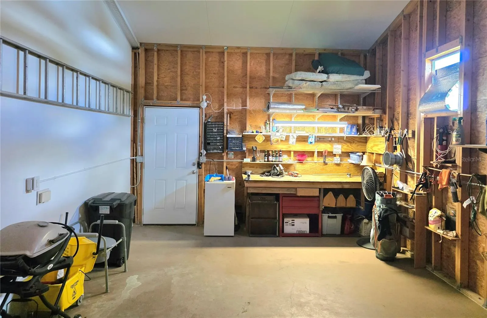 Attached climate controlled 1 car garage with electric opener, loft storage &amp; work bench.