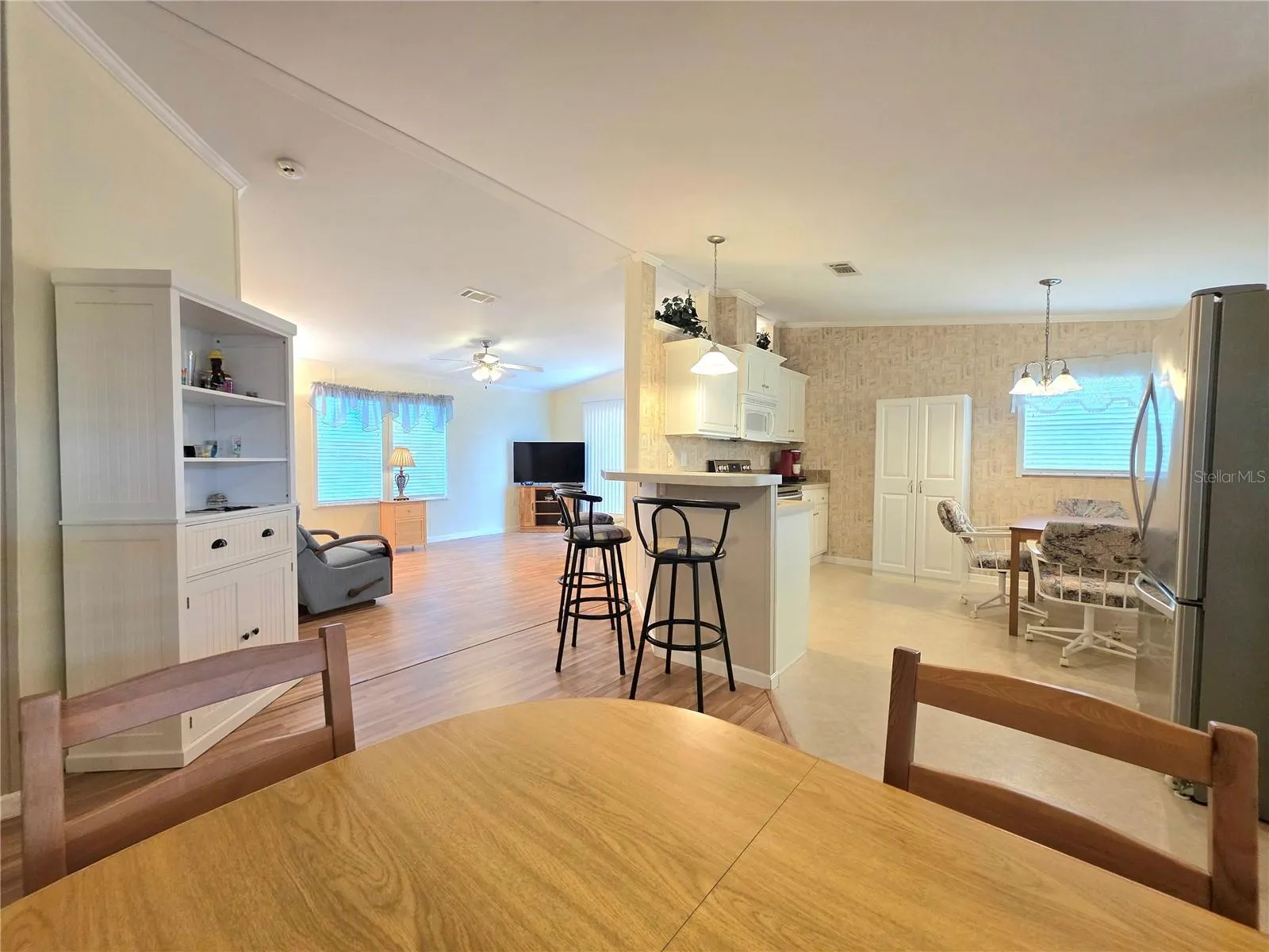 Formal dining area looking towards the living room &amp; kitchen.