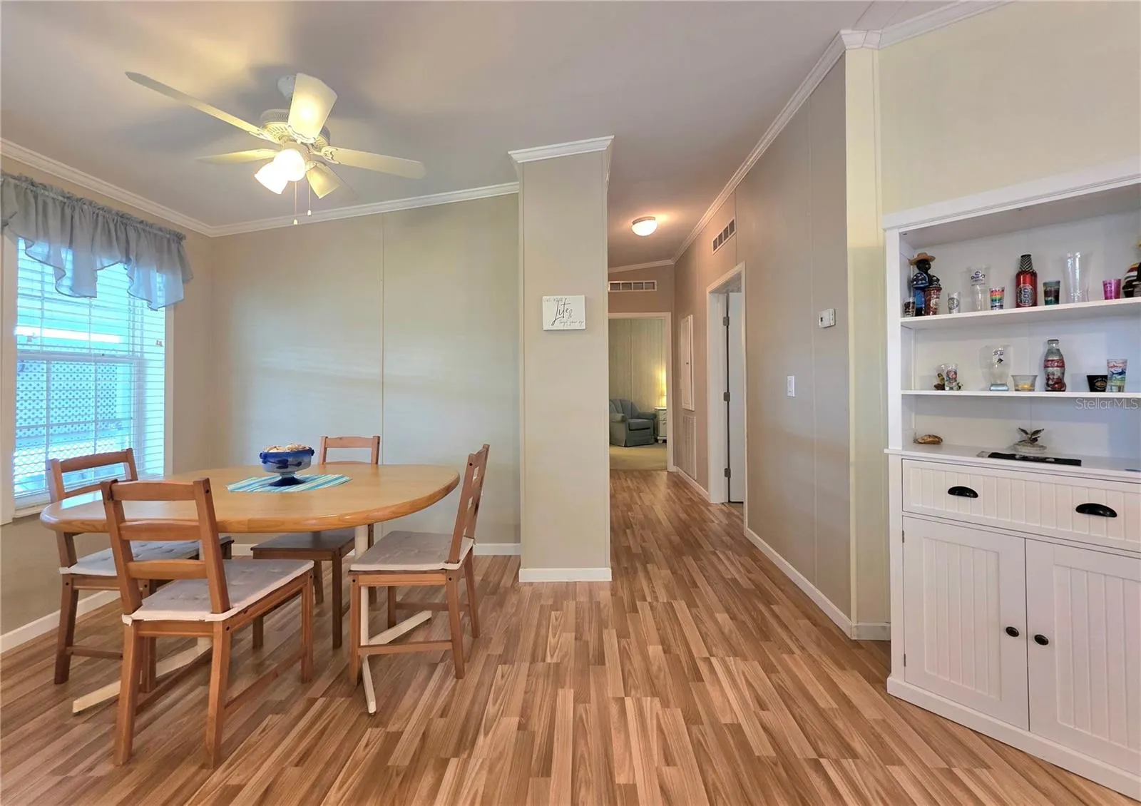Formal dining area &amp; hallway to the bedrooms, primary bathroom &amp; laundry room.