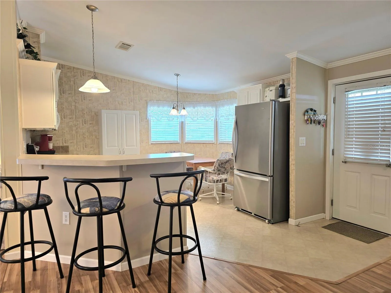 Kitchen with eat-in space &amp; breakfast bar.