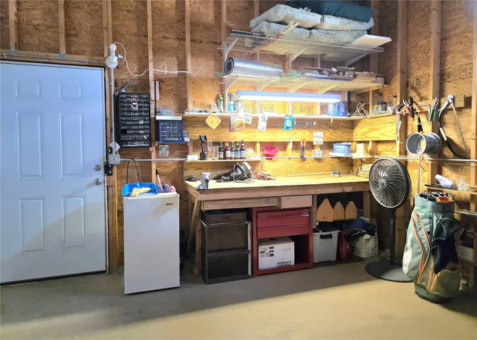 Attached climate controlled 1 car garage with electric opener, loft storage &amp; work bench.