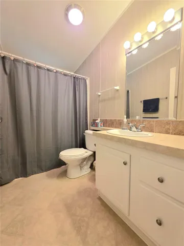 Primary bathroom features a bathtub with shower surround.