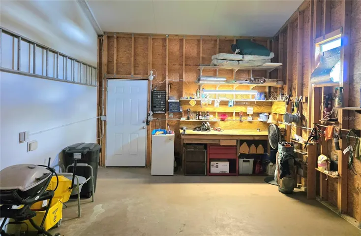 Attached climate controlled 1 car garage with electric opener, loft storage &amp; work bench.