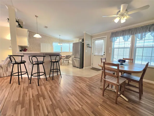 Formal dining area, kitchen &amp; main entry door to carport.