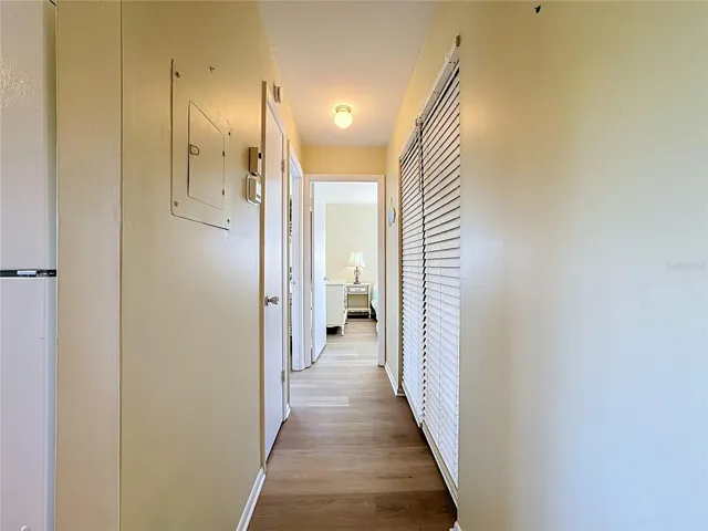 Hallway With Primary Bedroom Straight Ahead