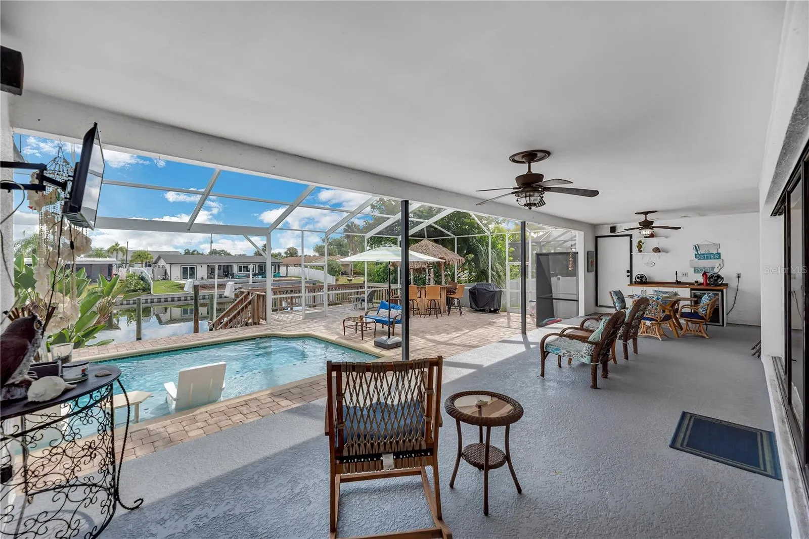This backyard porch is raised up 2 steps from the pool deck.