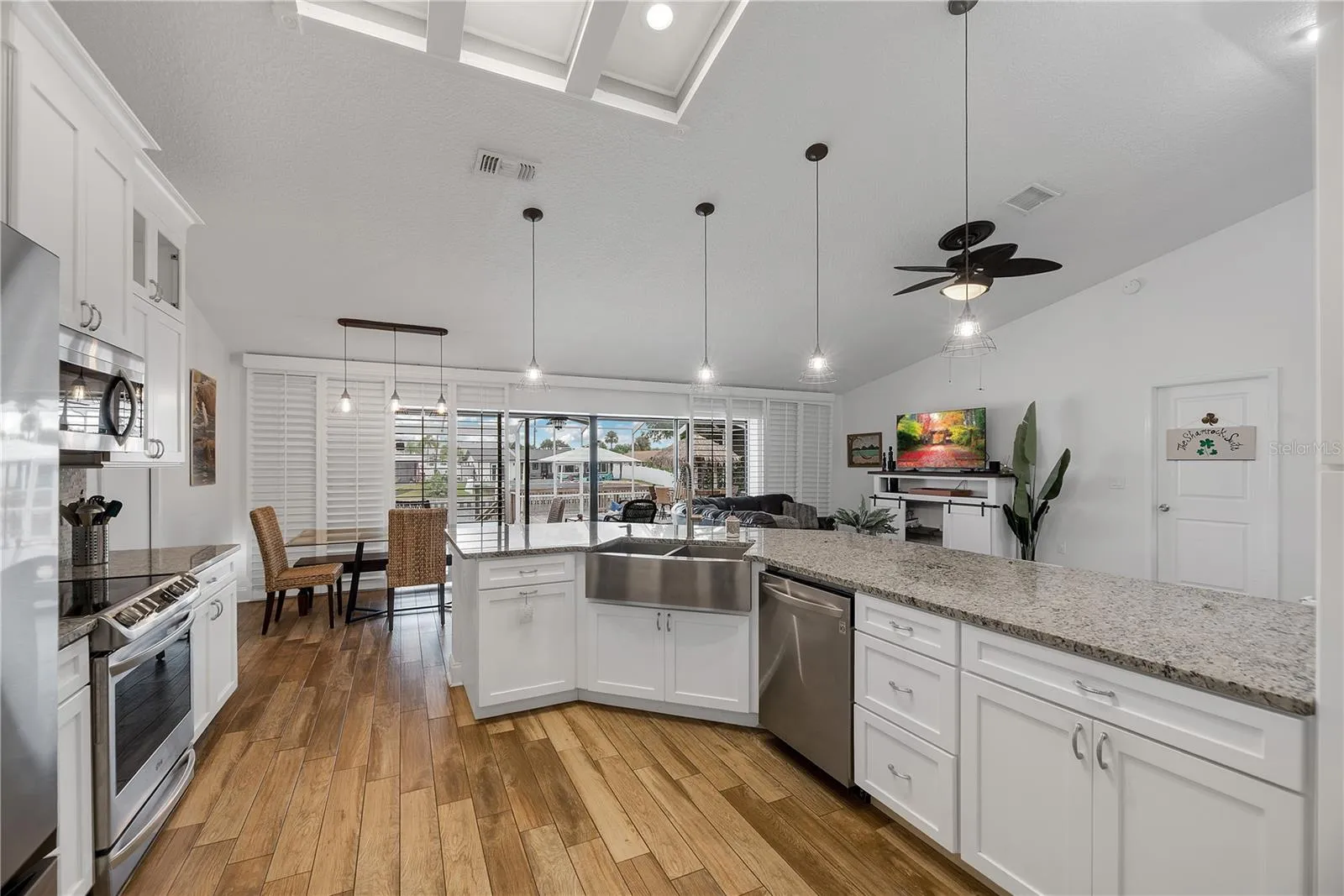 Plenty of drawer storage in this well thought out kitchen design and a double basin stainless steel apron sink.