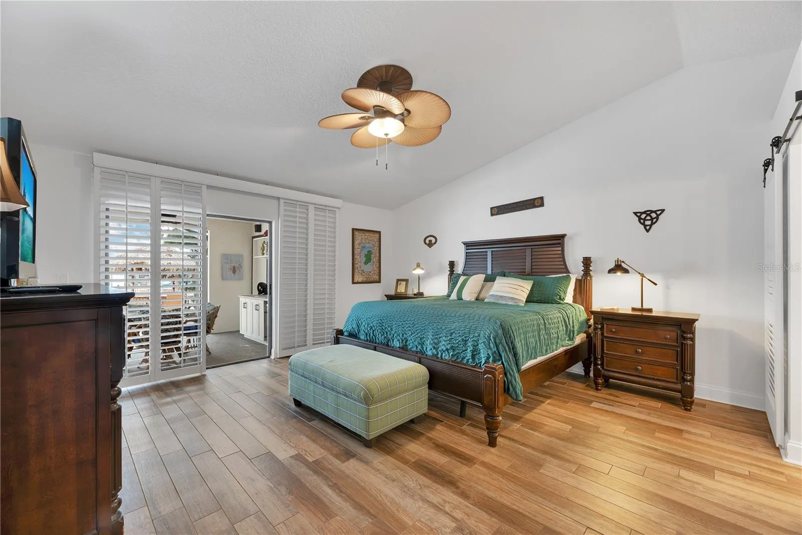 The Primary Suite features sliders to the lania, a large walk-in closet and beautifully appointed bathroom.