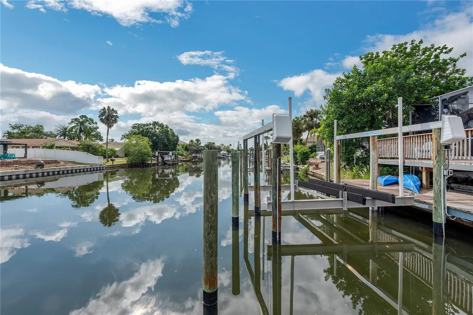 Convenient canoe, kayak, stand-up paddleboard storage is tucked beneath the raised wooden deck just outside the screened lanai, keeping your water gear easily accessible and neatly stored.